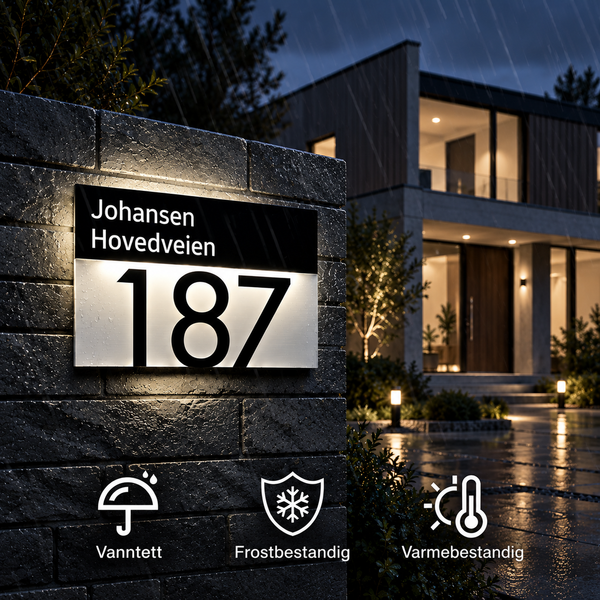 LumiAdres navneskilt med navn, gateadresse og husnummer opplyst om kvelden