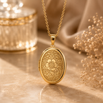 Vintage medaljong, gullfarget, med gravert blomstermotiv